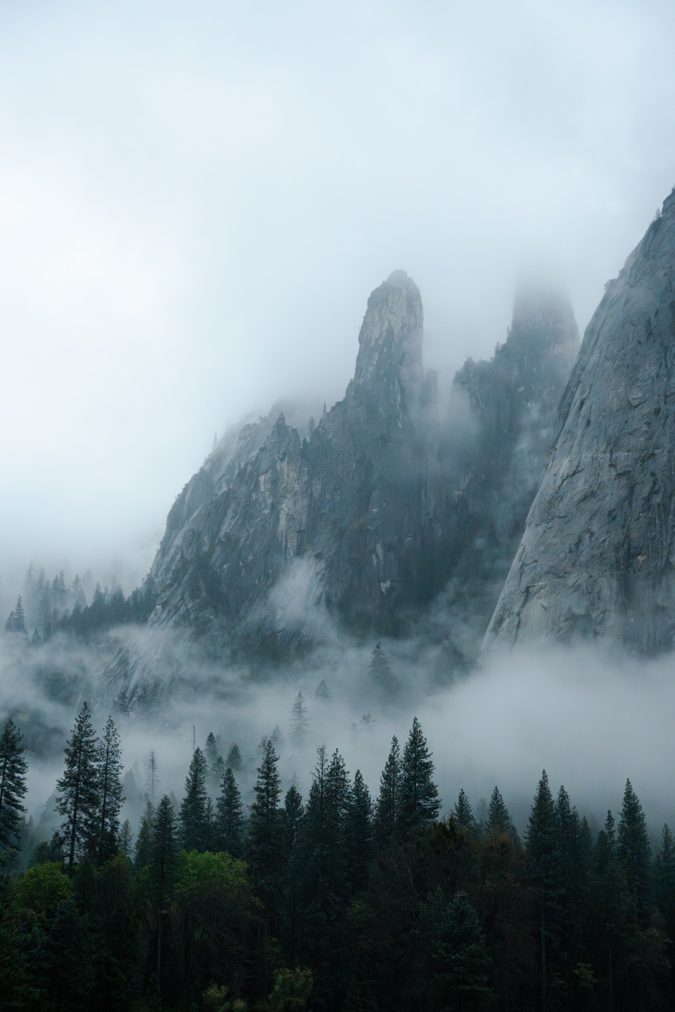 Granite spires emerging from low cloud